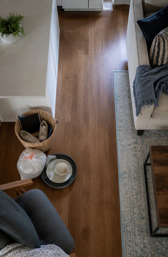 How to Clean Fast: 6 Steps to Speed Through the Whole House 3 Room with dishes, laundry, and misplaced items collected for cleaning